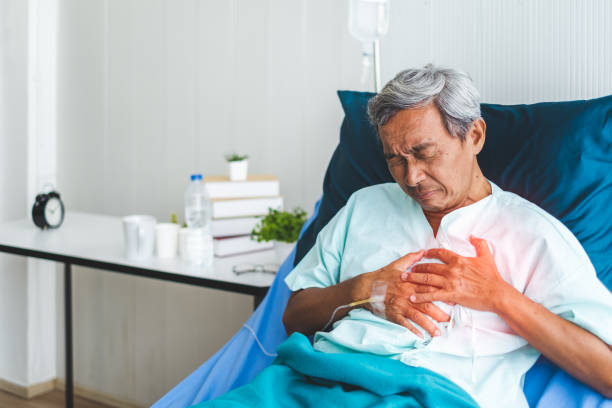 patient holding heart for heart attack concept