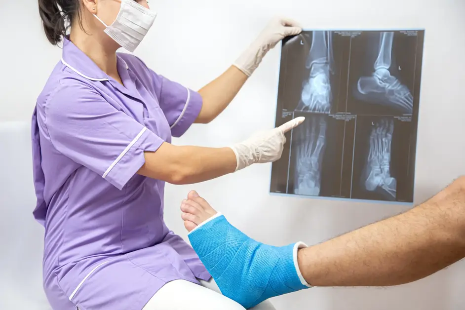 Doctor explaining foot bone fracture X-ray to patient at Neelam Hospital Rajpura.