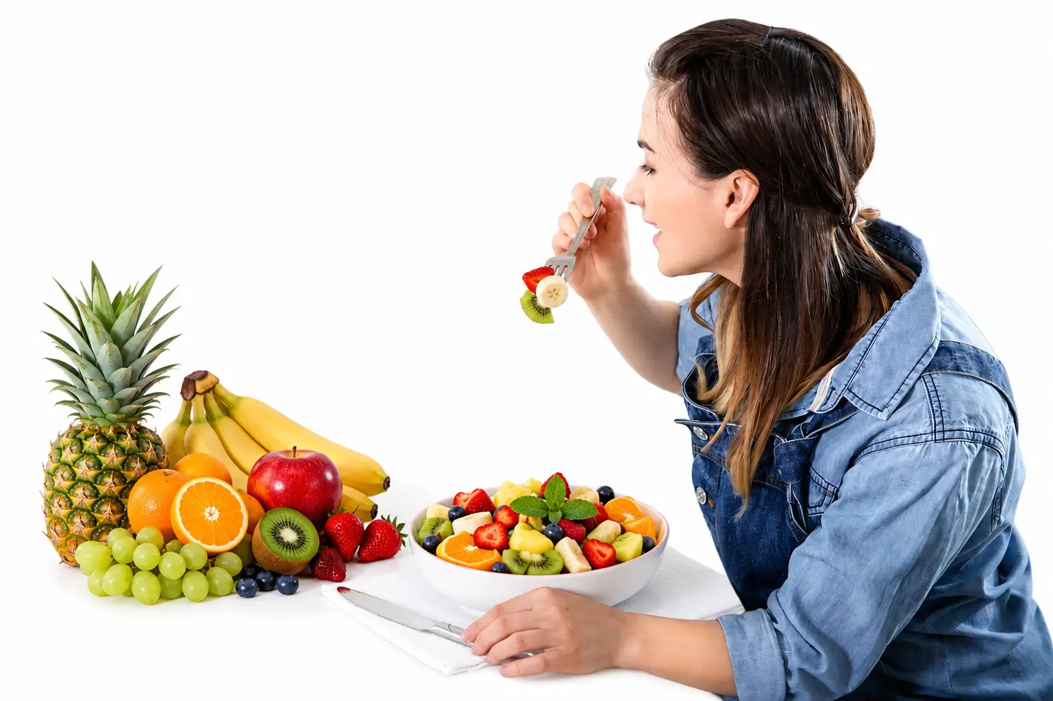 Woman eating a healthy fruit and vegetable meal for better nutrition and overall wellness.