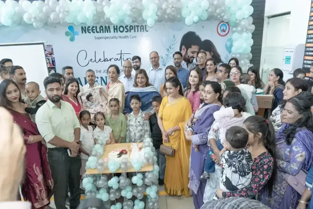 IVF success celebration with families and the Neelam Hospital team during a special event in Rajpura, Punjab.