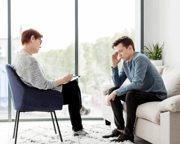 Psychologist counselling a patient during a mental health consultation, illustrating psychological care at Neelam Hospital, Rajpura.